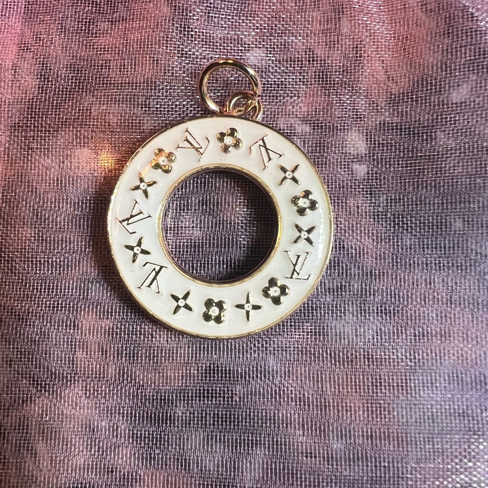 Louis Vuitton cream and gold zipper pull
